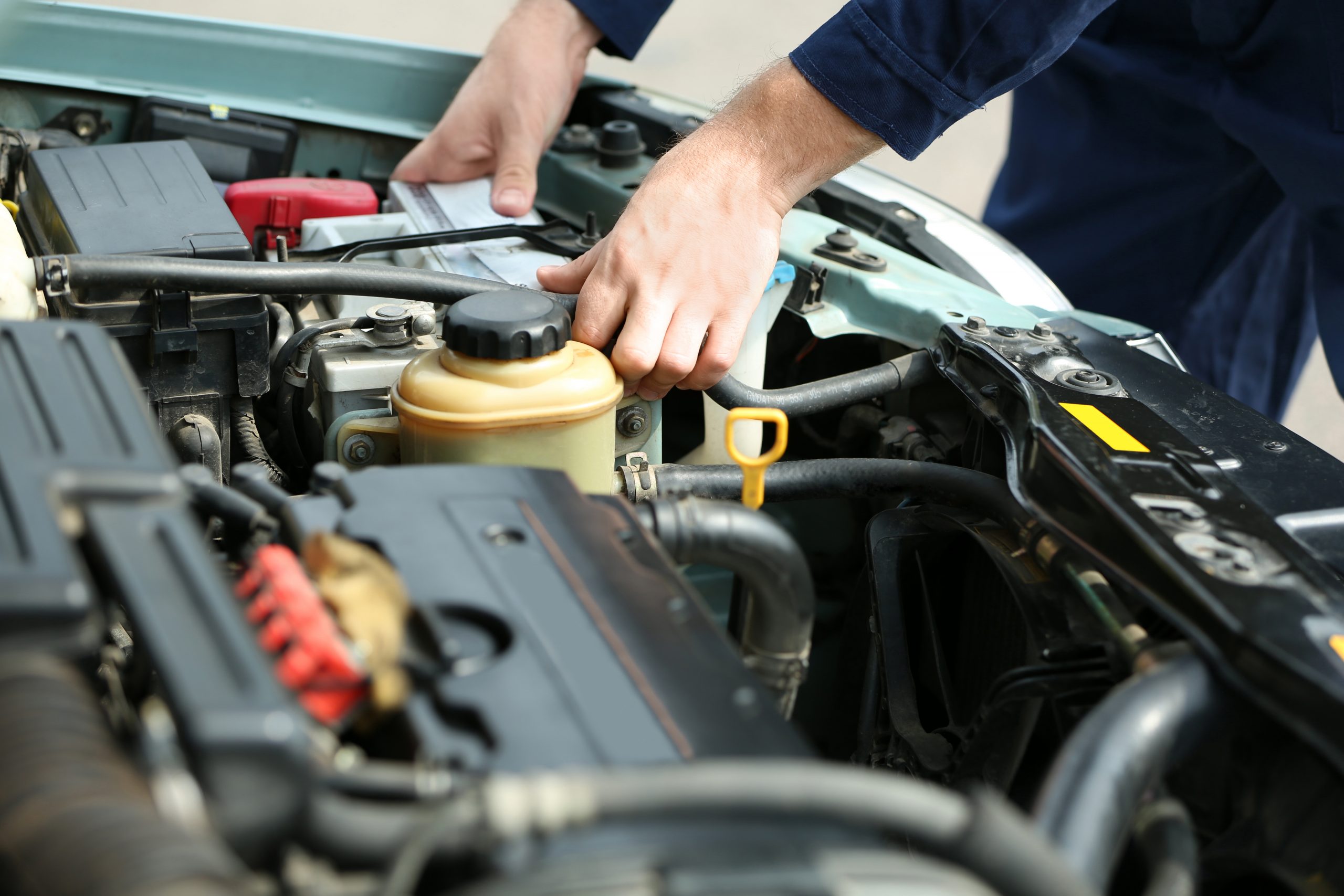 Mechanic,Hands,Checking,Up,Of,Serviceability,Of,The,Car,In